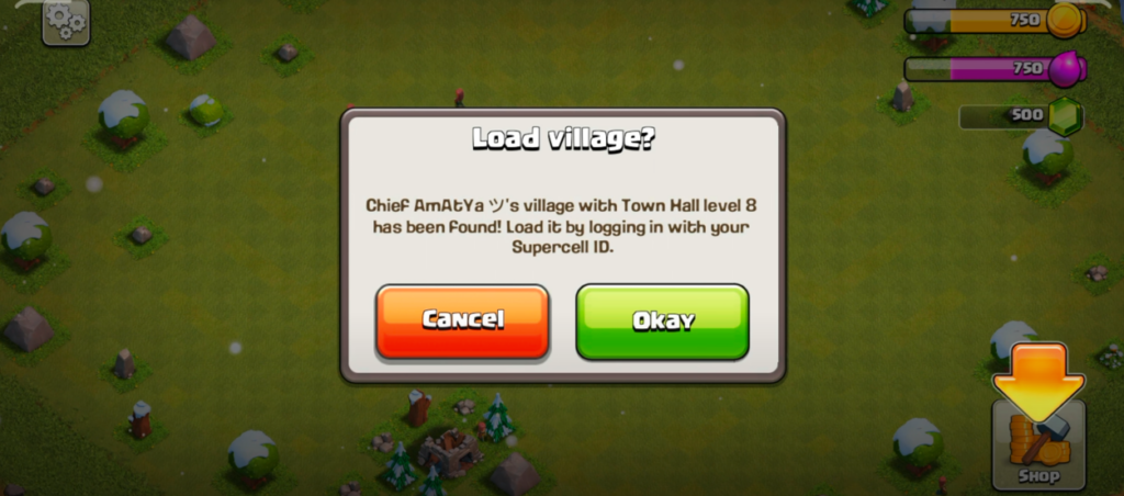 Clash of Clans game interface displaying prompts such as 'Load village?'
