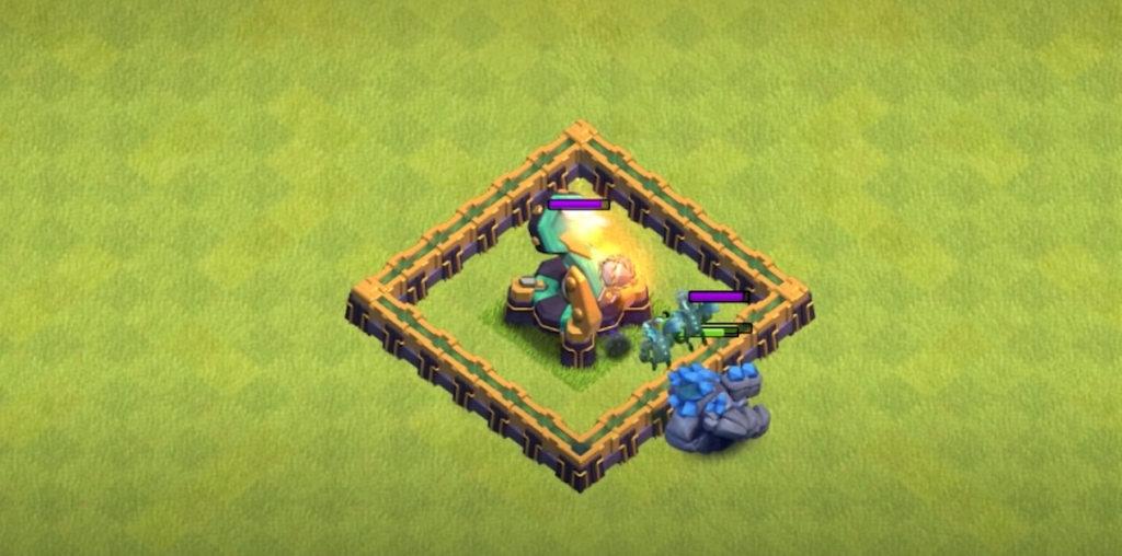 the Clash of Clans game, featuring the base defense strategy