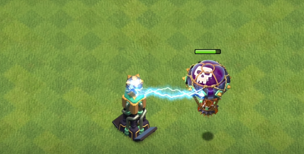 the game Clash of Clans, depicting a Hidden Tesla tower engaging in combat with an enemy